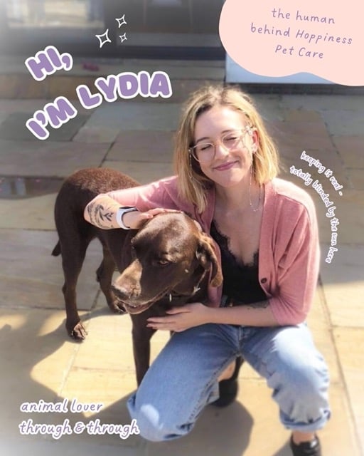 "Hi I'm Lydia" & "the human behind hoppiness pet care" & "keeping it real - totally blinded by the sun here" and "animal lover through and through" & lydia crouched next to a dog